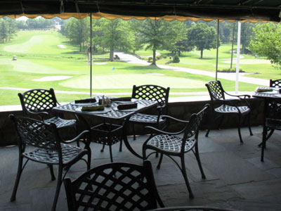 Private golf club amenities include seasonal outdoor dining overlooking the golf course at Copper Hill Country Club.